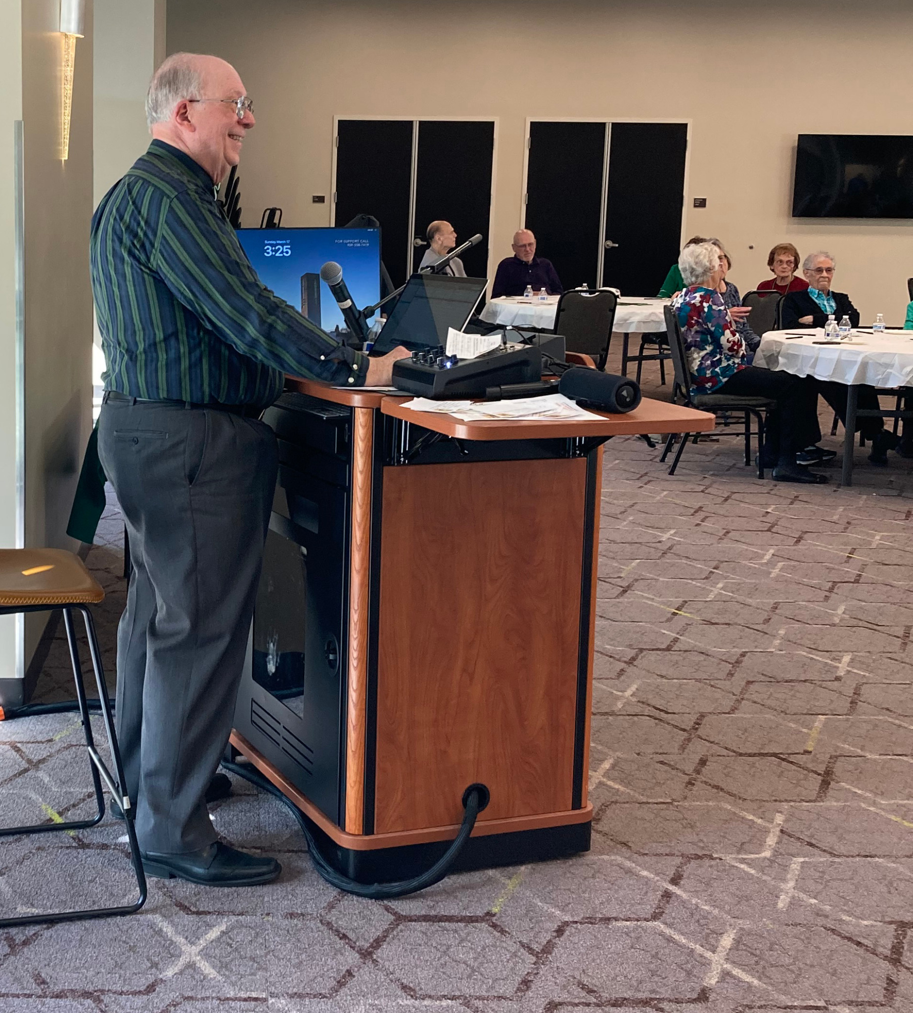 Lee McIntyre emceeing a Your Music Memories program